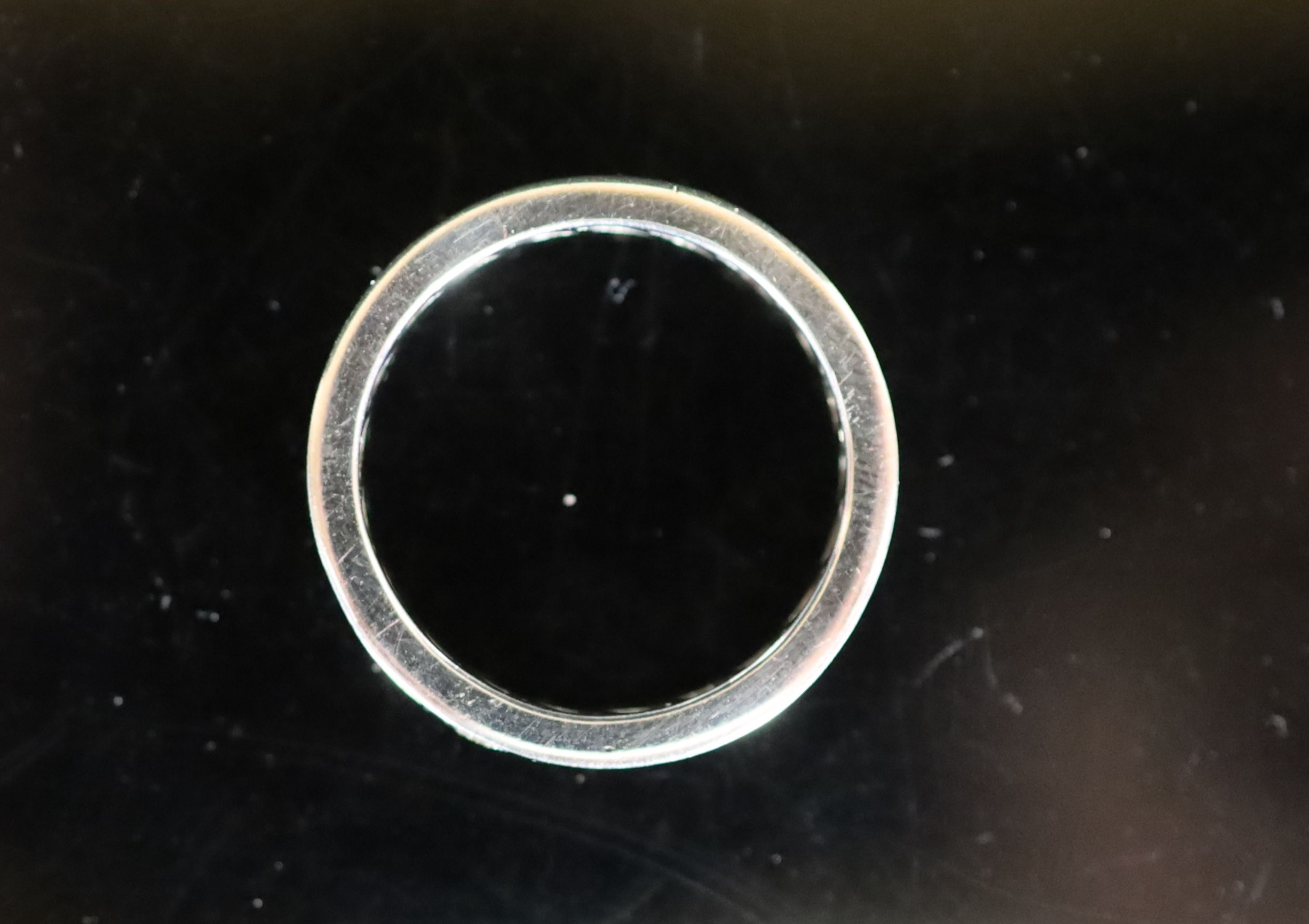 A mid to late 20th century platinum and diamond set full eternity ring